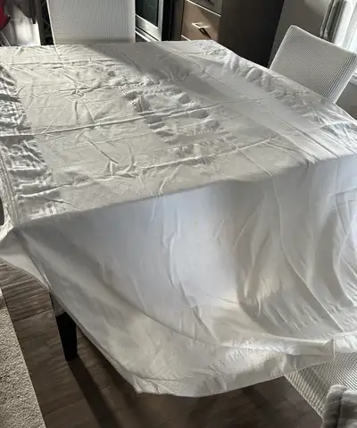 White long tablecloth. 99” x 58”. Picture has it on the small table to show but fits our long table...