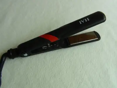 brand new HAI TITANIUM STYLING IRON - 1.25 INCH, View more