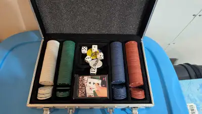 This Texas Hold'Em poker set comes with everything you need for a night of high-stakes fun, includin...