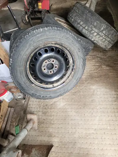 Black steel rims with winter rubber One bad three good Came off 2007 pontiac torrent but may fit oth...