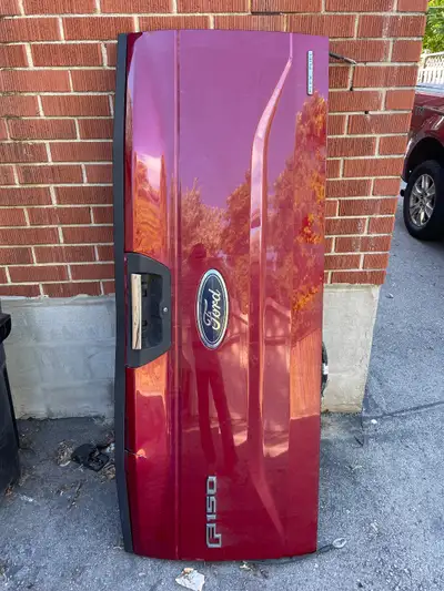 2016 Ford F150 tailgate (Fits 2016 - 2020). Ruby red colour. Camera and latch work. Emblems in good...