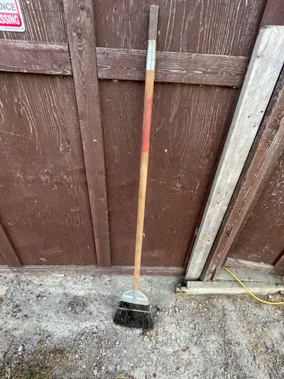 Hard bristle broom with Ice Scraper on end