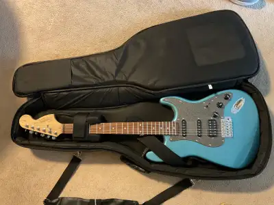 Electric guitar and gig bag with stand, View more