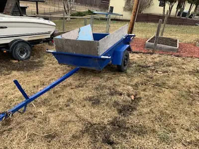 Single axel utility trailer. Wood lined box. Box approx: 48" W x 72" L. Trailer length approx: 12 1/...