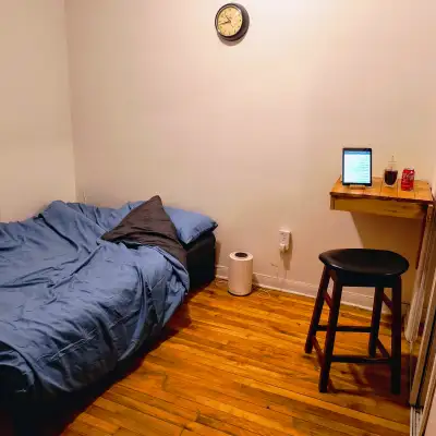 Month to month :) , and close to a metro point, with wifi. A big room with bedding, cafe table/chair...