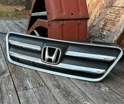 Front grill for 2005-06 CRV. Will not fit 2002-04. Good condition with no missing tabs. Located half...