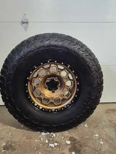 4 kmc Trek wheels 17x9 with -12 offset 5x127 bolt pattern 4 nitto recon grapplers 315 70r17 with 8/3...