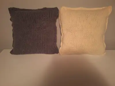Set of gray and ivory hand knit cushions with crocheted edges on three sides. They would go nicely w...