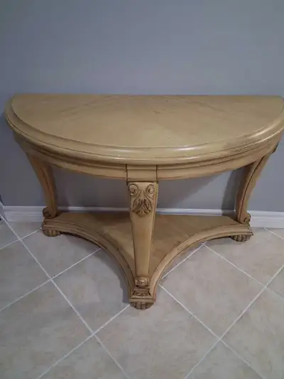 Add a touch of elegance to your entryway or living space with this charming half-round hall table! F...