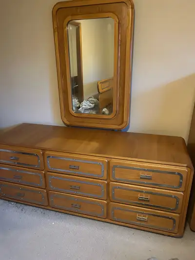 New looking Nine drawer dresser with mirror,six drawer, tall dresser and two end tables with two Dra...
