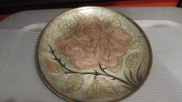 Vintage enameled brass wall plate 9.5" in diameter.