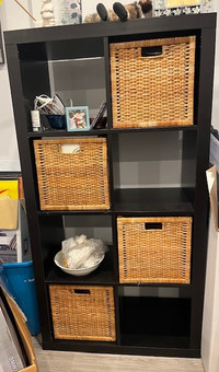 IKEA shelving unit with wicker baskets