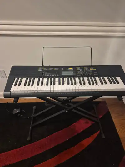 Casio Electronic Keyboard and stand., View more