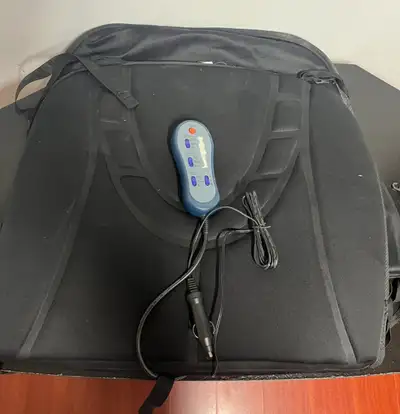Improve your comfort on every drive with this pre-owned Comfort heated and massage car seat cushion....