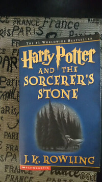 Harry Potter and the Sorcerer's Stone by J . K. Rowling