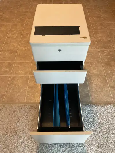 Tan 3 drawer metal file cabinet on casters with key , View more