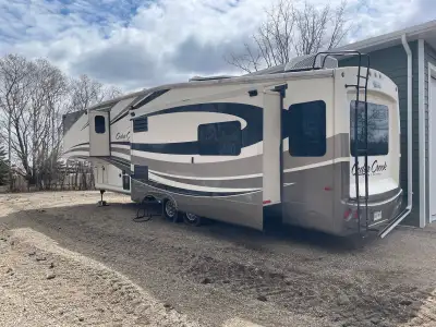 2013 Cedar Creek CRF36CKTS fifth wheel couples camper for sale. Good condition and well cared for. S...