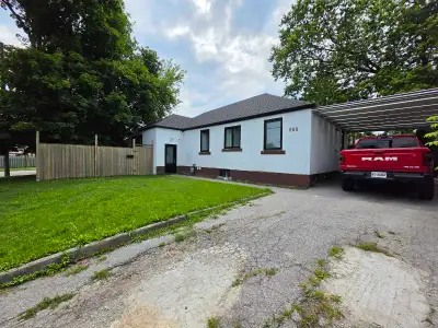 This bright, recently renovated basement apartment features modern vinal flooring, recessed lighting...