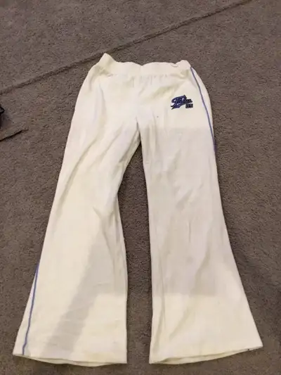 Get ready to groove in these vintage Fubu Forever 21 pants! These used, white velour bottoms feature...