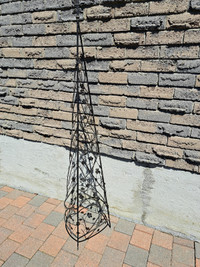 Conical Metal Obelisk with metal flowers