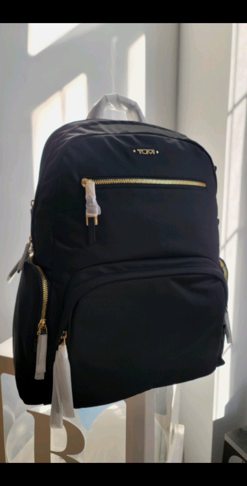 Tumi Carson Backpack black gold hardware Women's Bags & Wallets