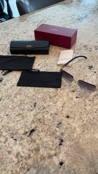 Cartier Sunglasses. Has box. Non Diamond Encrusted.