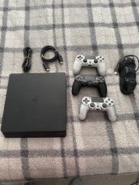 PS4 console with 3 controllers 