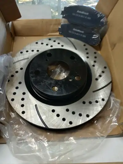 Brand new high performance, drilled and slotted rotors and dustless pads. Never installed (wrong one...