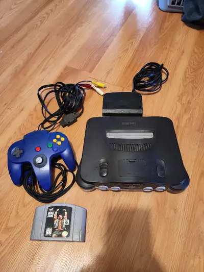 Comes with console and original cords, blue controller, & WWF WarZone.