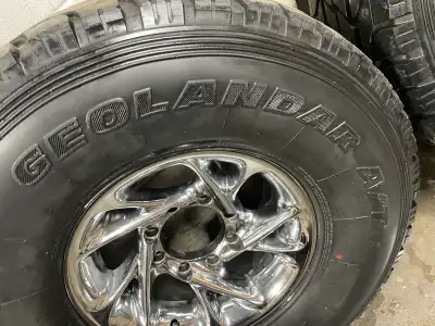 GMC DURAMAX DODGE RAM 2500-3500 LIKE NEW! Yokohama Geolandar A/T on American Racing rims 8x165 bolt...