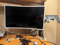 32 in curved Samsung monitor with arms and laptop stand
