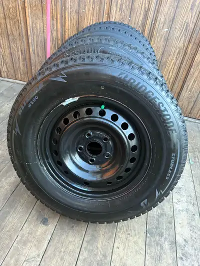 Almost new Bridgestone winter witer tires Off from honda odyssey