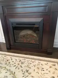 Electric fireplace with heat and fan