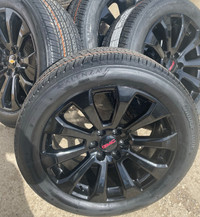 66. 2024 GMC Sierra Yukon Denali 22in Gloss Black rims and tires