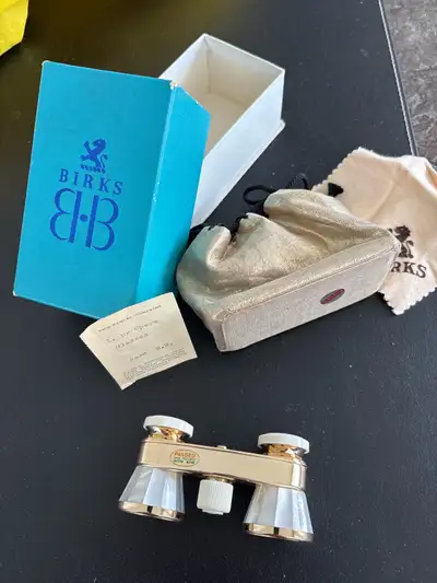 These are Birks 2.5X opera glasses with a gold finish and mother of pearl accents, complete with the...