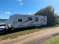 Seasonal site with 31’ trailer at Pyott’s West, Manitoba