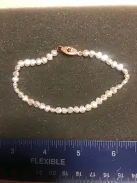 Natural freshwater pearls with a copper filigree clasp 