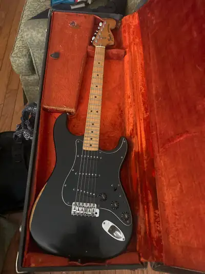 late-70s vintage instrument, often characterized by heavy ash or alder bodies, a large headstock wit...