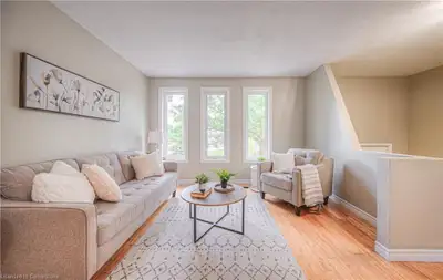Charming 3-bedroom house available for rent in Waterloo, featuring a spacious living area, well-lit...