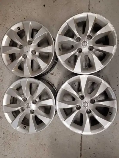 4 x OEM Nissan 16" rims from 2010 Sentra. A few cosmetic scratches & Nissan logo missing from one of...