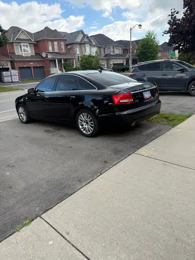 This used 2006 Audi A6 is a stylish sedan with 119,285 km, featuring a sleek black exterior and a co...