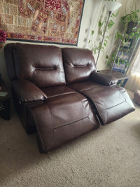 Leather living room all electric reclining set.