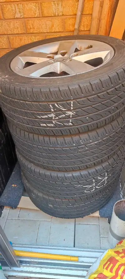 205/55/16 all season tires on honda alloy rims. Asking for $450.
