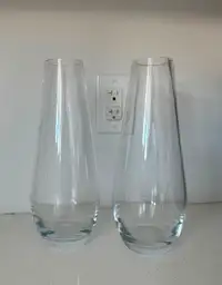 Two tall narrow glass vases