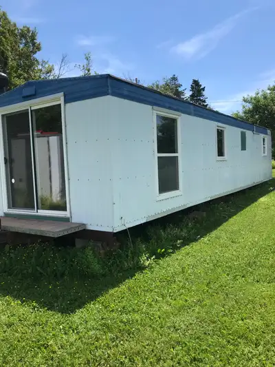 12x40office trailer has been upgraded with new vinyl windows ,sliding patio door Has new shower stal...