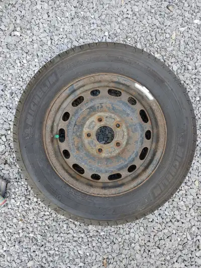 A set of 4 used Michelin 205/65R15 all-season tires on steel wheels for sale. Good tread remaining....