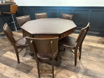 Brunswick poker table in excellent shape. Leather top. 8 folding chairs. Swivel drawers to hold a dr...