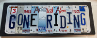 Gone Riding sign made from recycled license plates. 