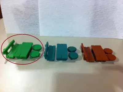 This ads shows 3 variants of Bench, Stool and Table Smurf playset and is offering one circled in RED...