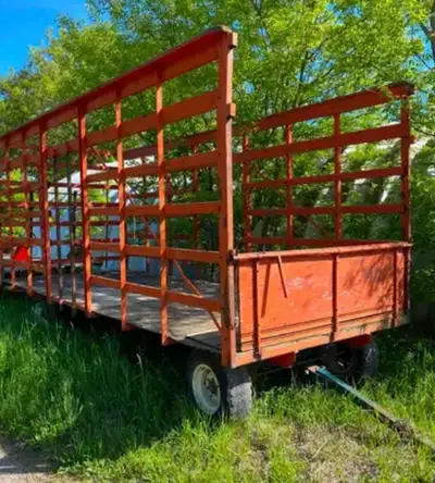 Looking for a bale thrower wagon prefers with steel rack or really good wood one .